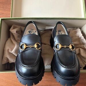 Elegant Black Leather Loafers with Gold Detailing
